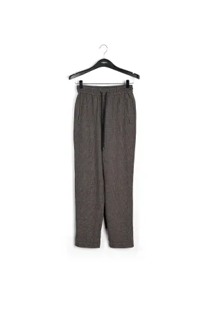 Brown pants with beige and pink check motif